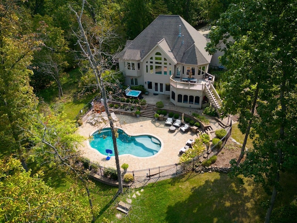 Aerial view of pool, hot tub, and tranquil setting of Lake Charrette Retreat!