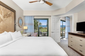 Primary bedroom features a king bed, private patio door, and ensuite bathroom (Oceanfront View)..