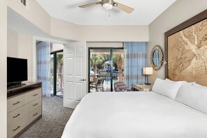 Primary bedroom features a king bed, private patio door, and ensuite bathroom (Garden View)..