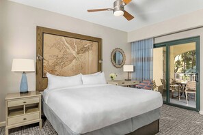 Primary bedroom features a king bed, private patio door, and ensuite bathroom (Courtyard View)..