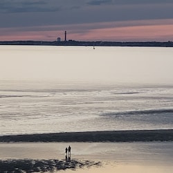 low Tide during sunset looking at Provincetown Pilgrim's Tower