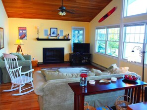 OVERALL:  The large living room that includes a great view of the lake from the many windows.  (Note that the fireplace is not for guest usage.)