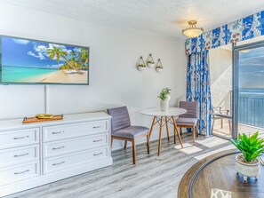 A cozy table and seating area overlooking the ocean.