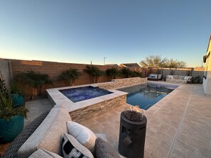 Gorgeous travertine patio with abundant seating for your entertaining pleasure.