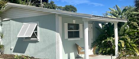 Come relax at our tropical retreat with beautiful Bermuda shutters. 