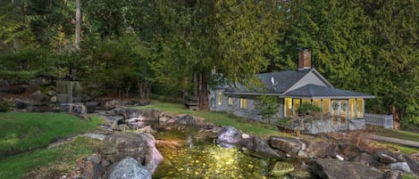 Beautiful pond and waterfall next to the house and can be seen from windows!