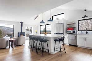 Massive island for prep and entertaining. Designer kitchen.