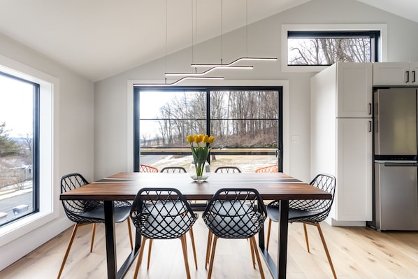 Comfortable dining for 6 and access to the balcony.