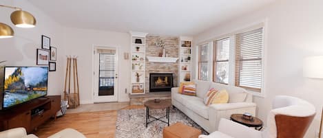 Living Room with Fireplace, Sleeper Sofa, and TV