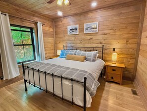 The primary bedroom has its own full bathroom, closet, and television.