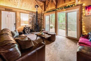 Cozy living room with wood burning stove and a relaxing view!