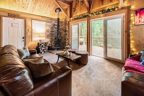 Cozy living room with wood burning stove and a relaxing view!