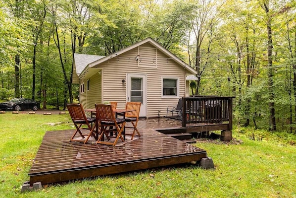 Backyard with dining spot, grill and firepit for-cooking and gatherings