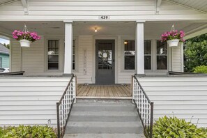 Sit on our big front porch and watch the neighborhood in Adirondack chairs. 