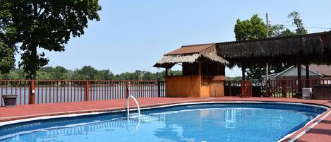 Pooldeck with adjoining Tiki Bar. Outdoor kitchen a few steps away.