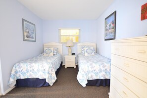 Guest bedroom has two twin beds