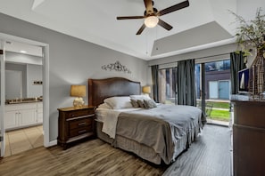 Master w/king bed, blackout curtains, smart tv, + sliding glass doors to patio.
