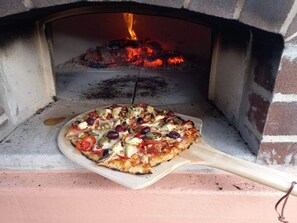 Option to cook your own wood-fired pizzas