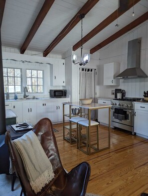 The kitchen has been newly updated with stainless steel appliances 