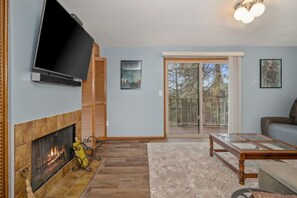 Lower level living room with tons of board games and xfinity cable tv.