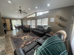 Open layout of living room flowing into dining room