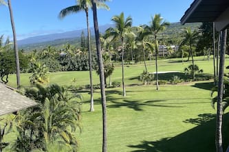 A Plush Two-level Condo with Ocean and Golf Course Views From its Lanais