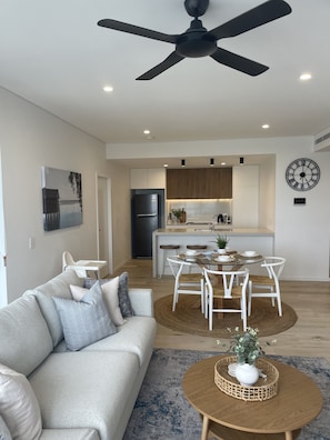 Beautifully appointed open plan kitchen over looking lounge room.