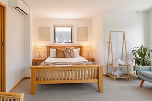 The bedroom is located in the downstairs area