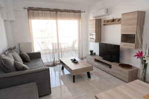 Modern and designed living room with air-condition and TV