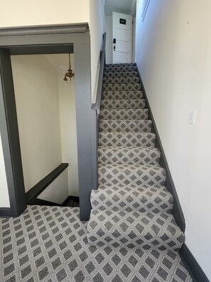 Stairway from landing to unit entrance