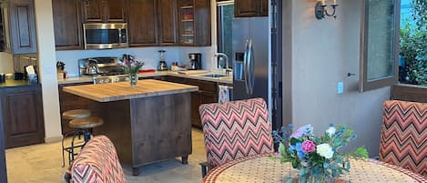 from enclosed terrace room looking into kitchen