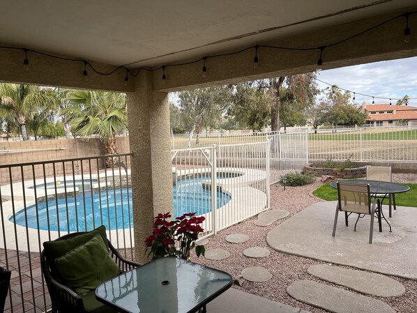 Mickey Mouse shaped pool, private golf course in background.