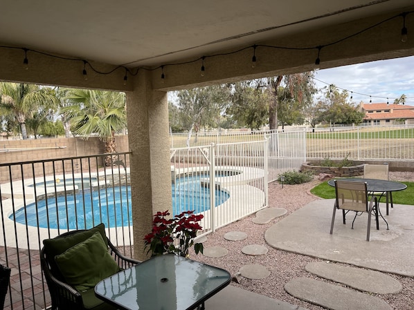 Mickey Mouse shaped pool, private golf course in background.