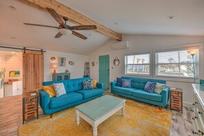 Teal door to upper balcony with seating for 6
