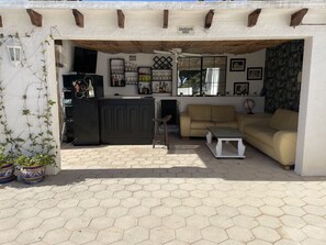 Out door bar area with tv 
Nice to relax  beside the pool