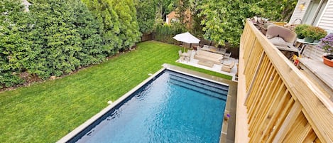 Deck view of pool and lounge area.