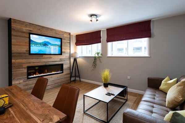 Feature wall with smart 50" TV and 60" fireplace