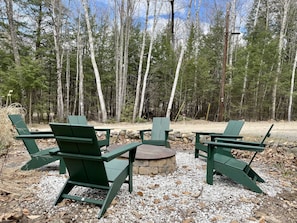 Make memories while relaxing in Adirondack Polywood chairs around the fire pit.