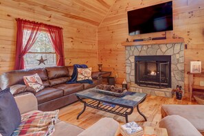 Living Room with 70" Samsung SmartTV, Gas Fire Place and Full Size Sofa Sleeper