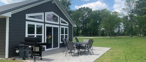 Lakeside patio with gas grill and gas firepit