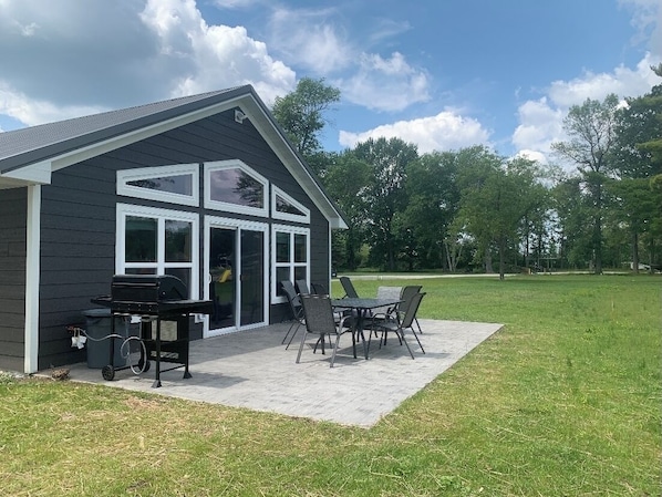 Lakeside patio with gas grill and gas firepit