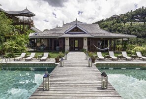 Bridge over pool to villa.