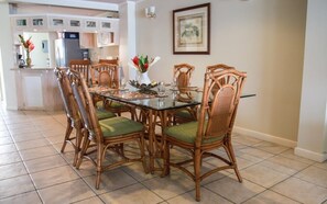 Formal dining with views out to the water.