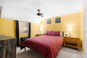 Master Bedroom features a comfortable queen-size bed and a TV, ensuring a restful night's sleep and entertainment at your convenience.