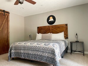 The master bedroom has a high-quality king mattress.