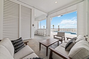 Relax in style with stunning views and inviting seating by the pool!