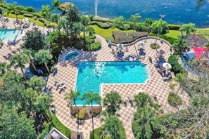Poolside Paradise: Dive into relaxation at our beautiful community pool surrounded by lush greenery!