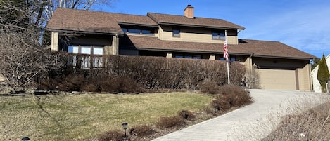 The garage can park one car. An additional car can park in the driveway. 