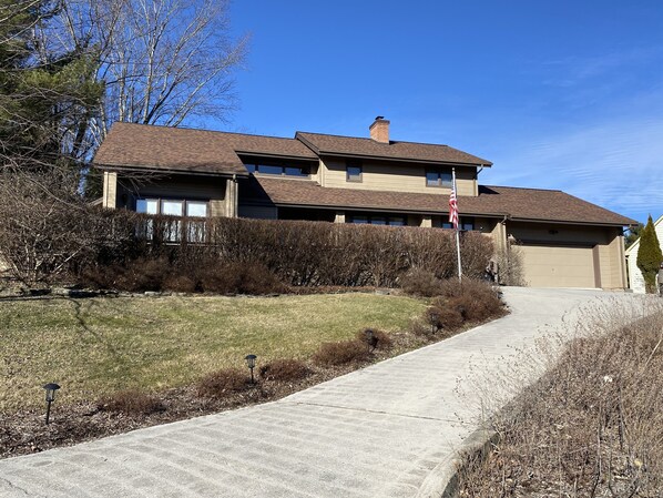 The garage can park one car. An additional car can park in the driveway. 