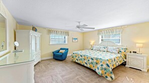 Charming master bedroom with a cozy feel, offering comfort and relaxation after a fun-filled day.